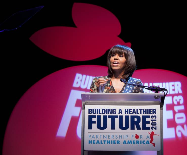 Michelle Obama speaks from a podium onstage.