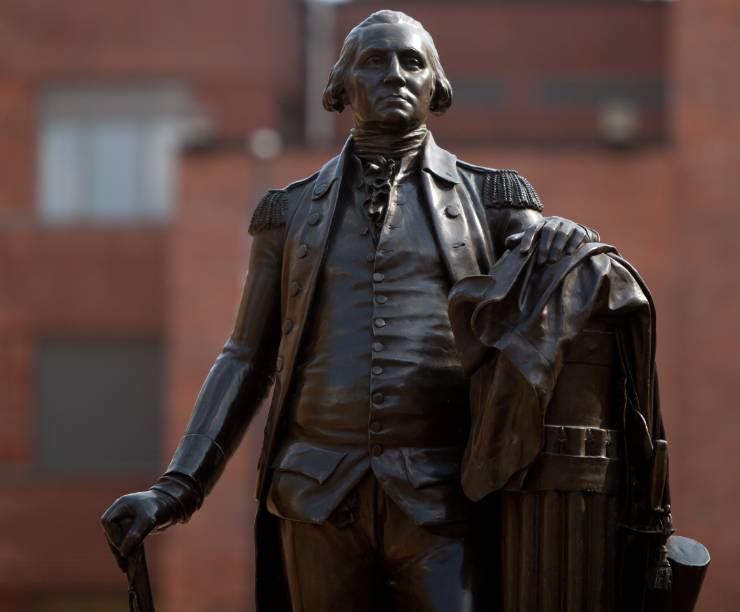 A bronze statue of George Washington in University Yard