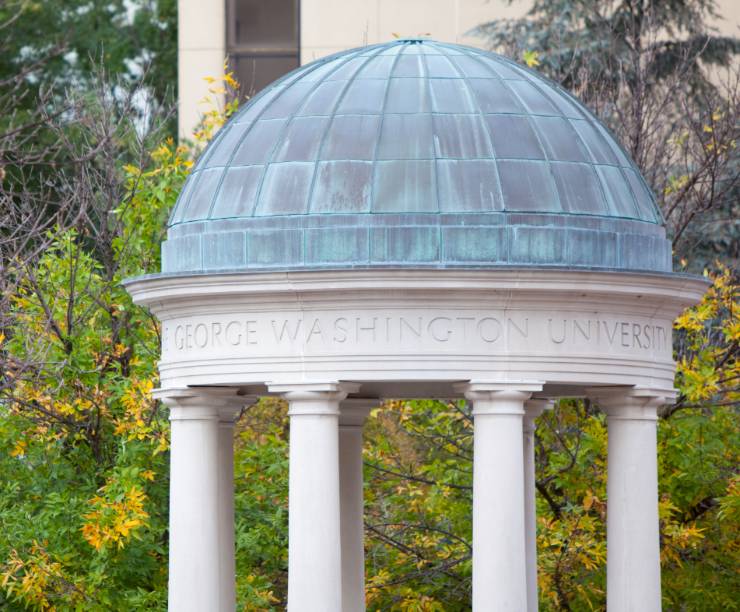 The dome of the Tempietto against gold and green leaves.