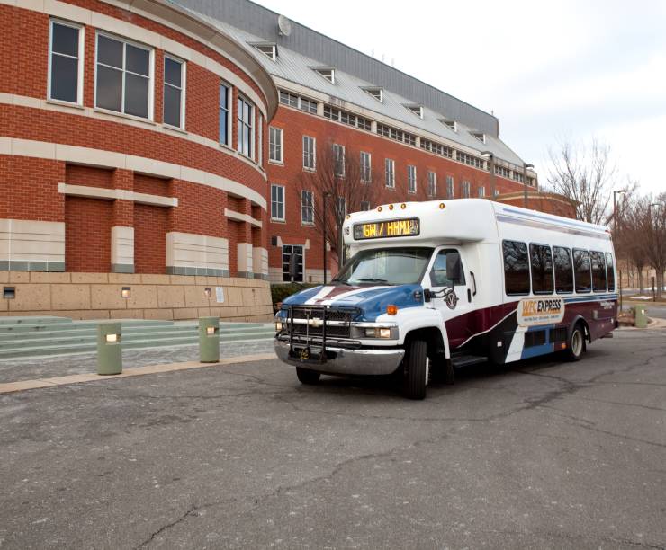 A Wiehle Express shuttle sits in front of Exploration Hall.