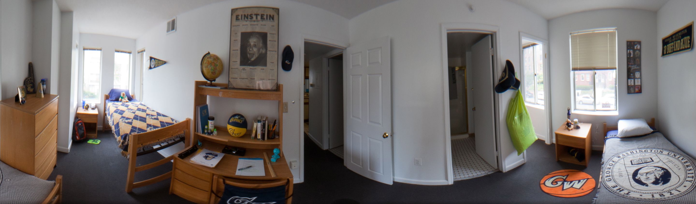 A panoramic view of a double residence hall room.