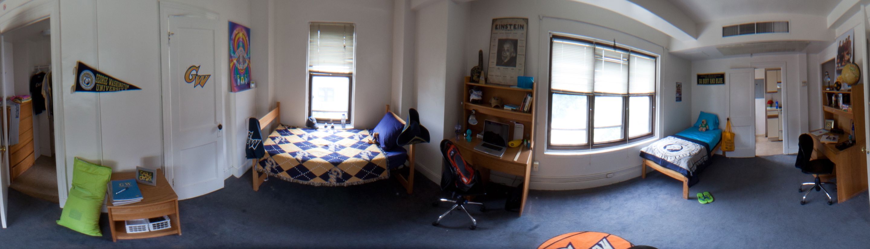 A panoramic view of a double residence hall room.