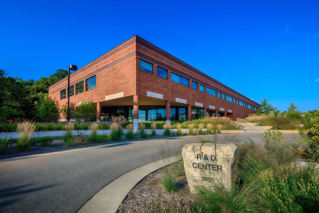 A photo of the Research and Development Center from the driveway which includes a rock sign.