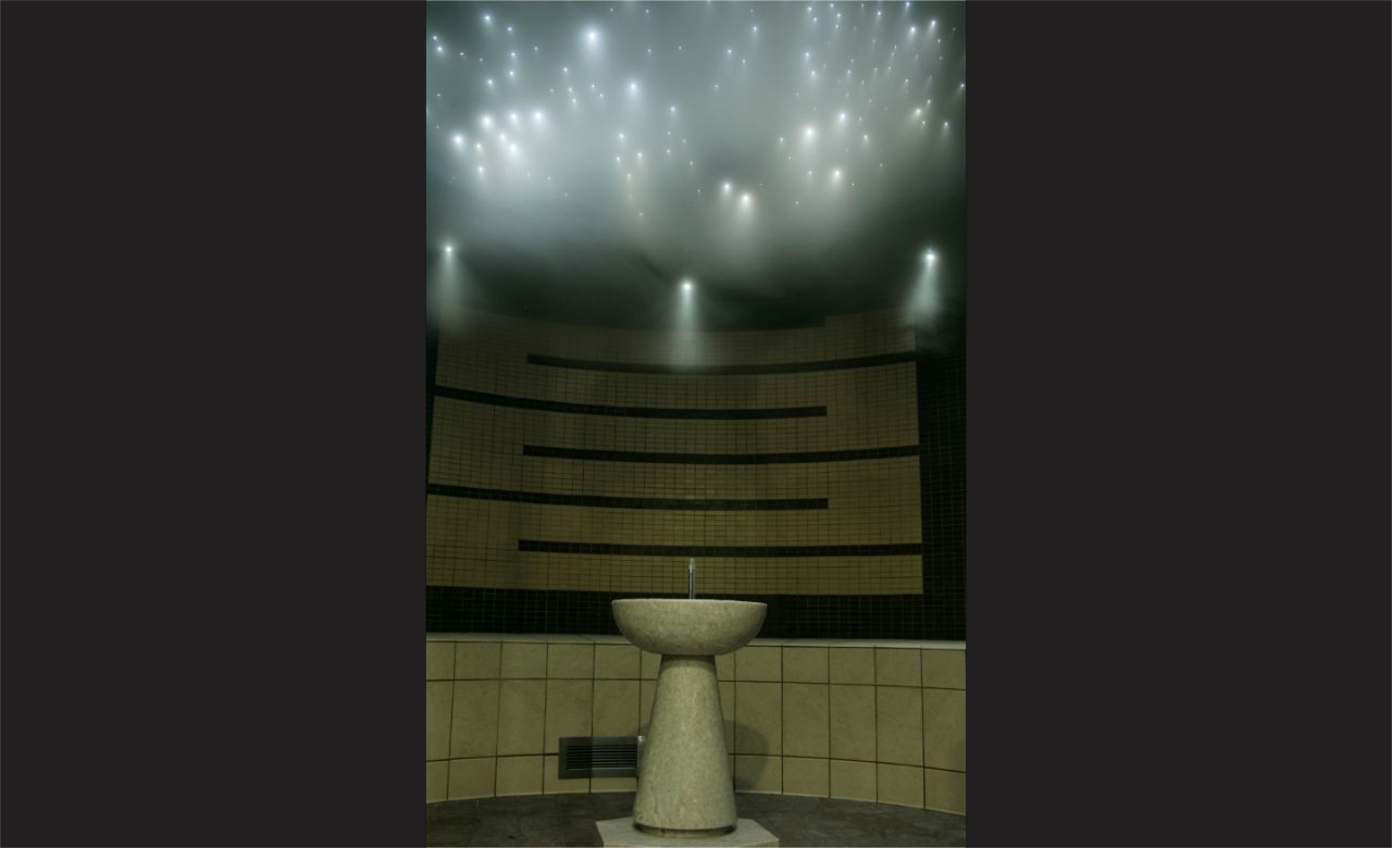 The Faraday Center steam room with constellation lights in the ceiling.