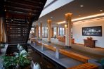 This is an image of the Feynman lobby area, which includes enormous boulders, wooden benches, a small reflection pool, and a metal staircase.