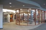 The cafeteria of the BTC, showing tables and chairs with windows to see out onto the patio.