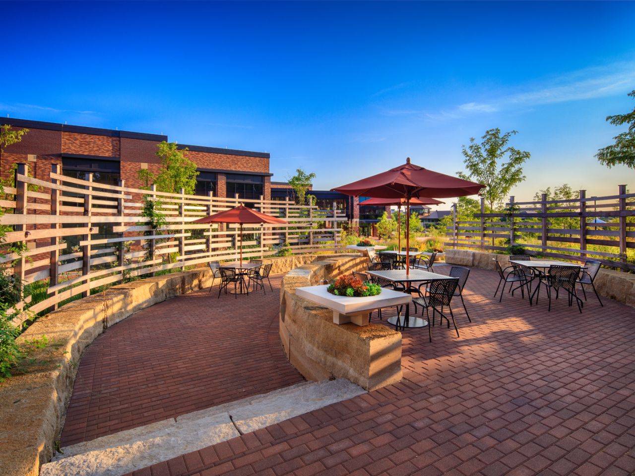 A view of the third space called the Basket from which you can see Feynman Center in the background, the brick of the basket and the wooden beam walls.