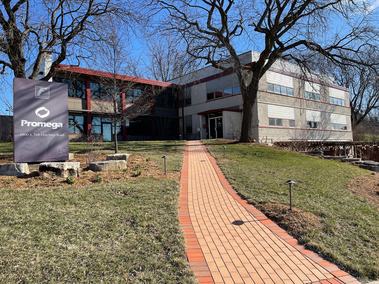 The Faraday Center sign next to the driveway.