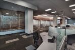 This photo is taken in the large common area in Feynman where there are open concept office spaces and meeting rooms.