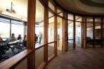 This picture shows a meeting room in Agora which is in use and has floor to ceiling glass windows.