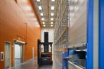 The Feynman Center's warehouse is pictured here with a forklift driver putting bins away.