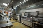 The Feynman cafeteria is pictured here with one of our chefs baking with a large industrial oven.