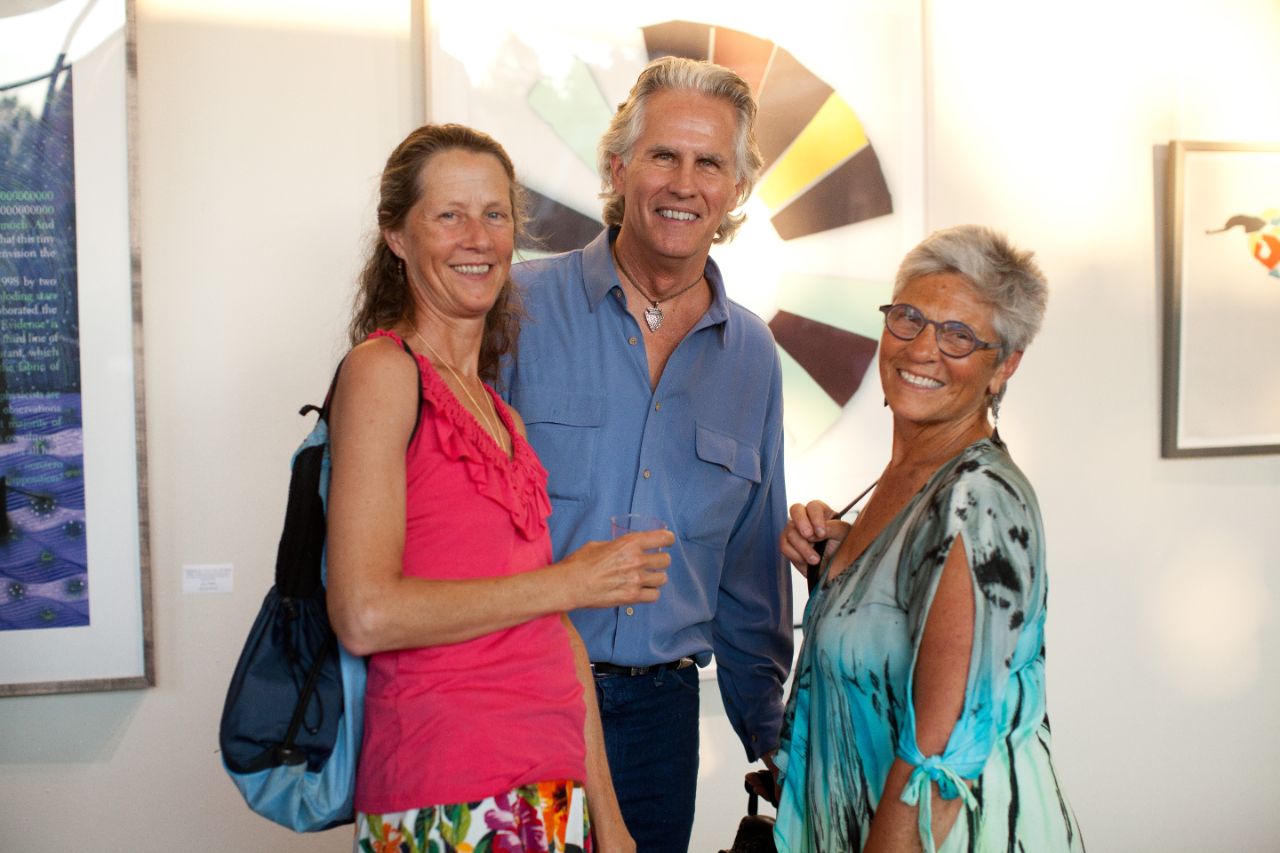 David Swadener (curator) poses with two people at the 2015 Fall Art Show.