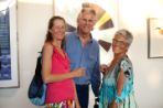 David Swadener (curator) poses with two people at the 2015 Fall Art Show.