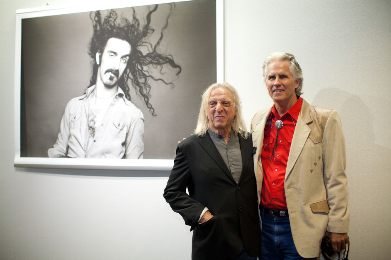 2014 picture of Norman Seeff with Daniel Swadener in front of Norman's art.