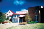 The entrance to Woods Hollow Children's Center on a sunny day.