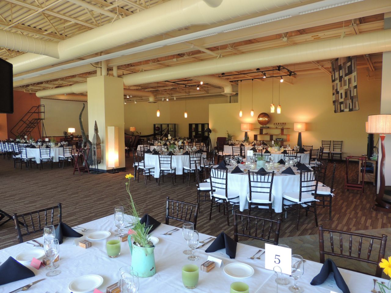 The Ideation Center set up for an event with tables full of linens.