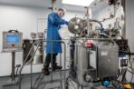 A lab employee works with the bulk manufacturing lab in Feynman.