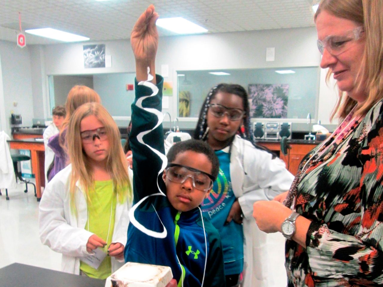 Kids learning in a lab at the BTCI with an instructor.