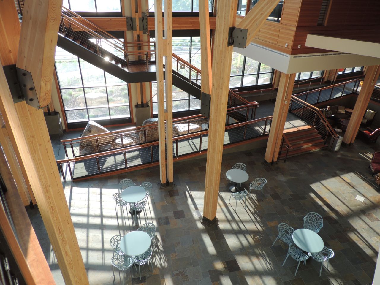 The Feynman Center from the second floor balcony showing the two story wooden support beams.