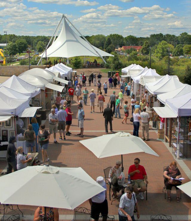 A view of the pavilion and tents lining both sides of the Agora parking lot for the art show in 2012.