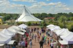 A view of the pavilion and tents lining both sides of the Agora parking lot for the art show in 2012.