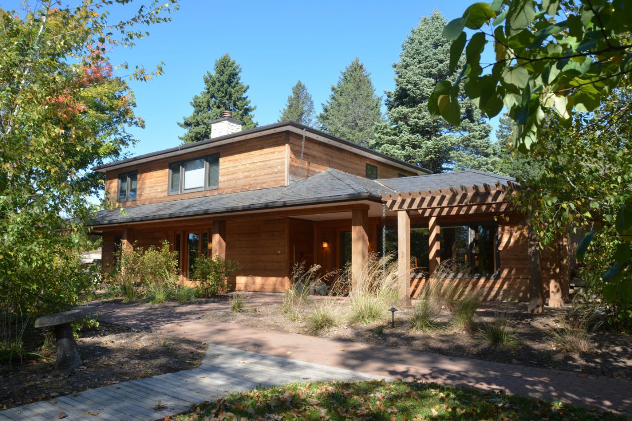 View of the front of the guest house with fall foliage.