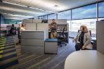 The customer service area in the Kepler Center where four employees work in cubicles.