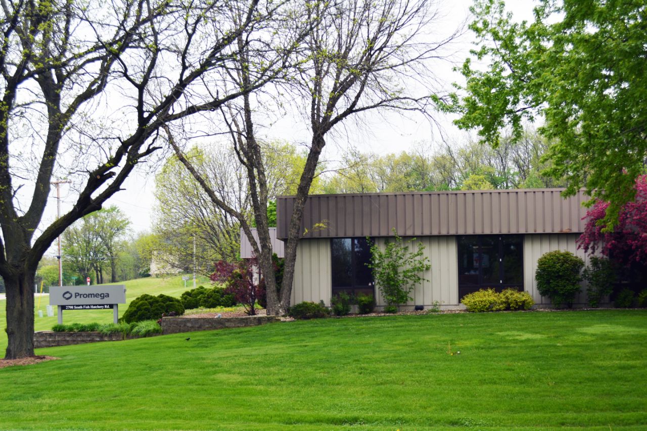 photo of the Lamarr Center from the street including the Promega ground sign out front