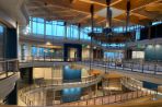 The Kornberg Center Atrium has suspended bridges that connect each section of the building three floors above the atrium floor.