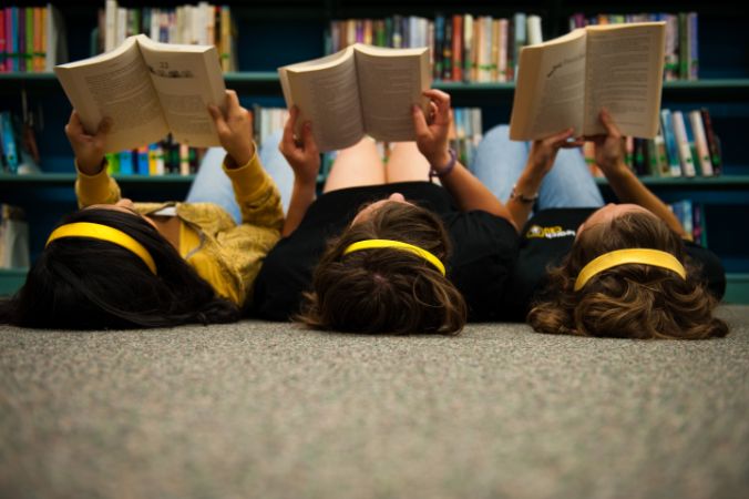 Reading on the library floor